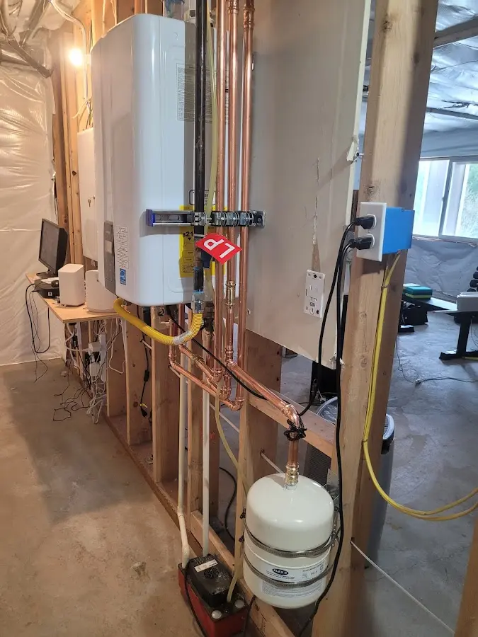 Licensed plumber repairing a kitchen sink in Hartland