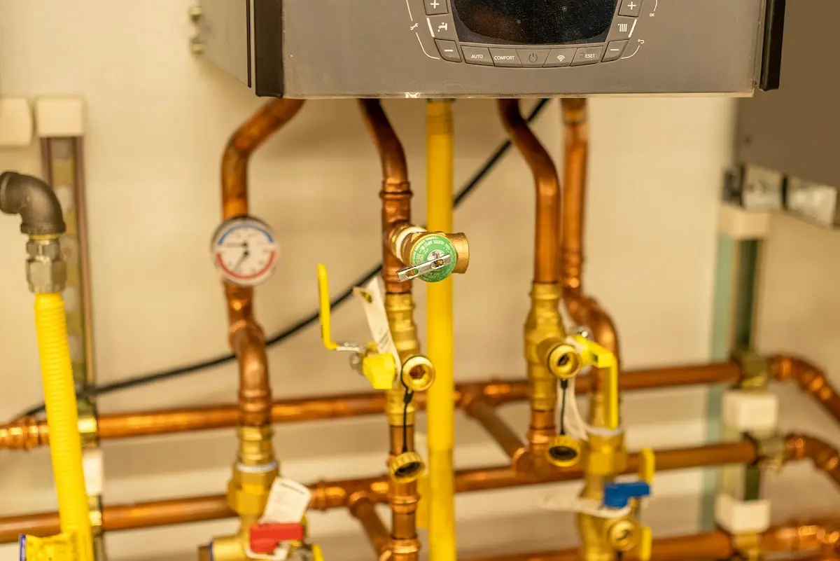 Licensed technician providing Backflow Prevention for a homeowner in Hartland